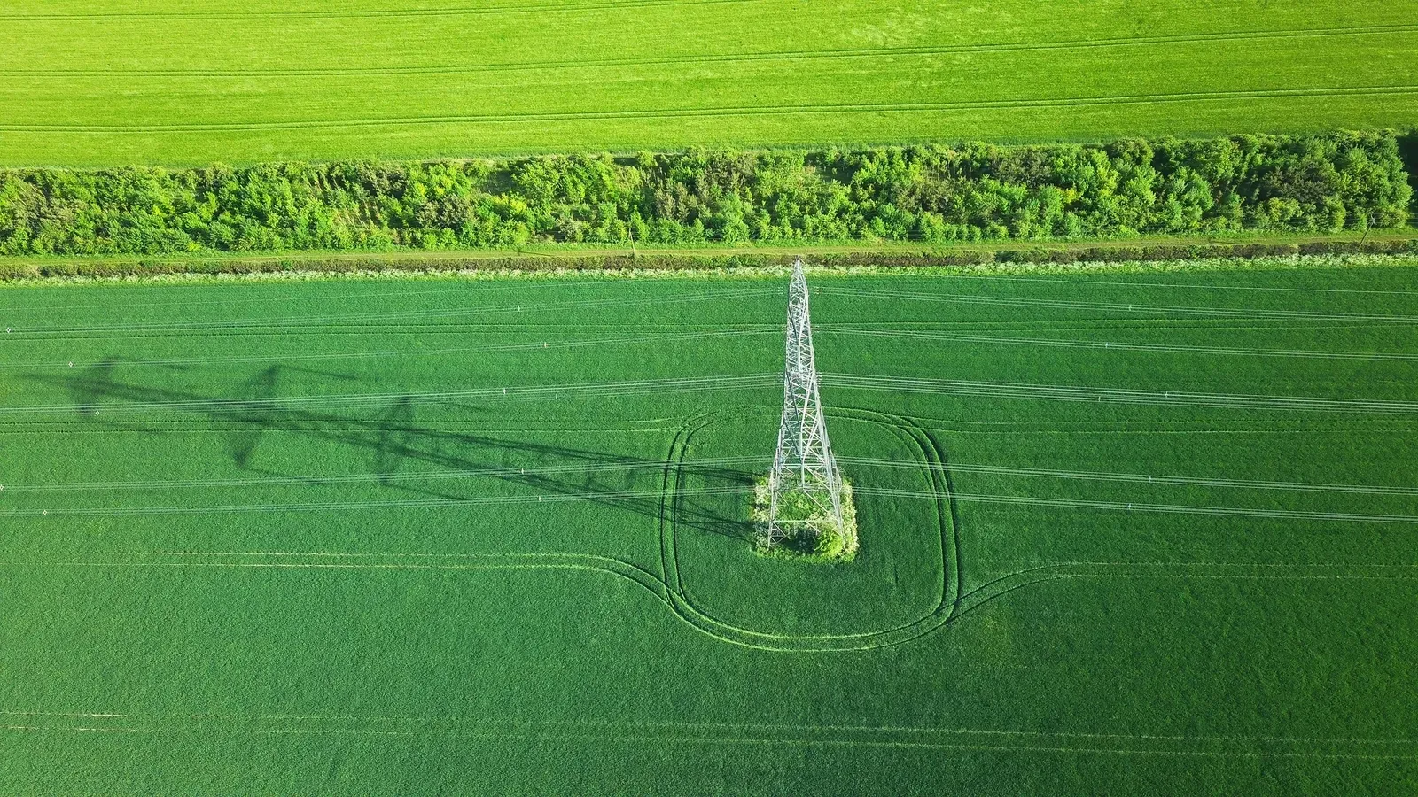 Drone inspecting power transmission lines along a corridor