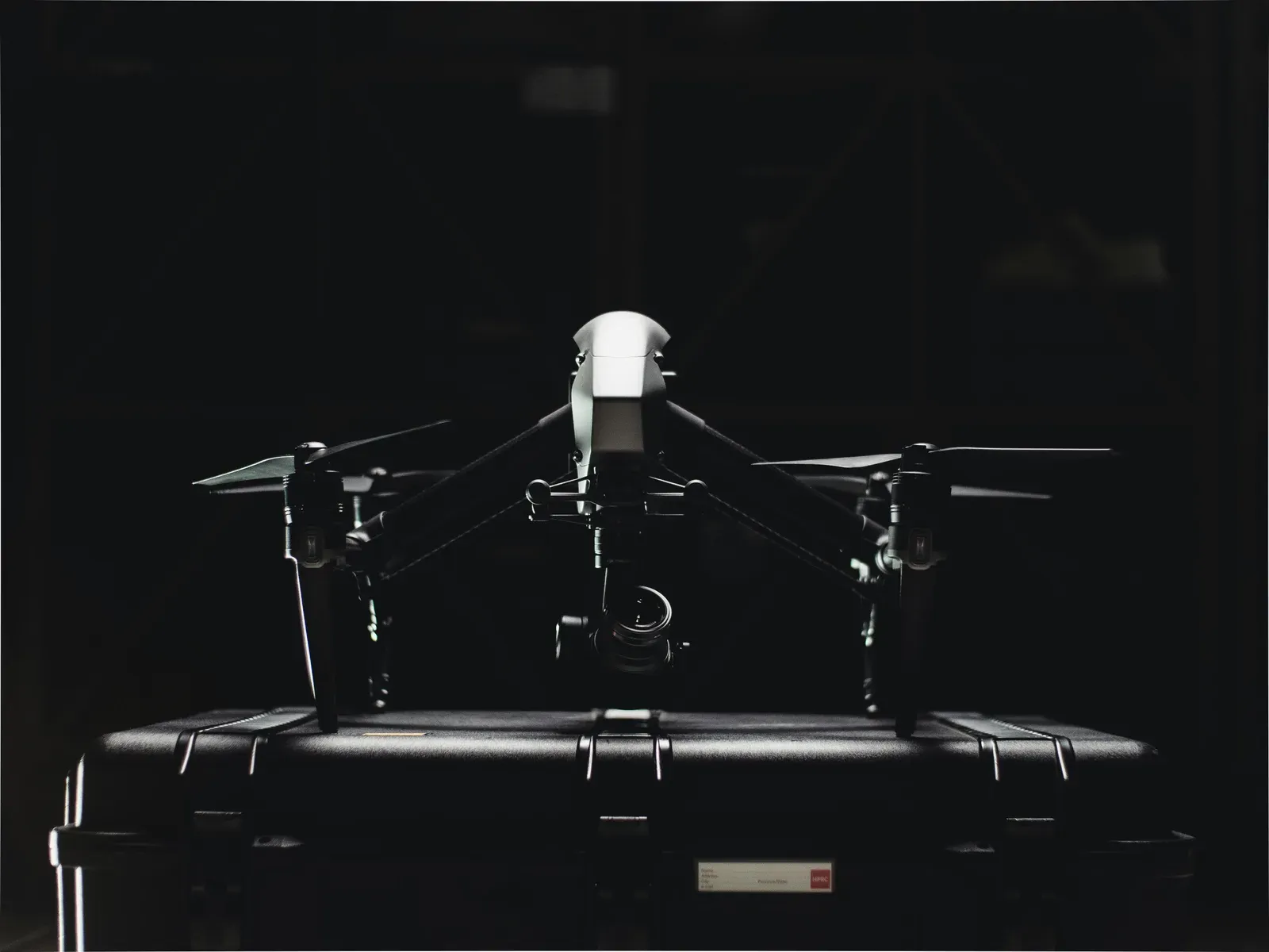Industrial-grade quadcopter drone ready for takeoff on a launchpad