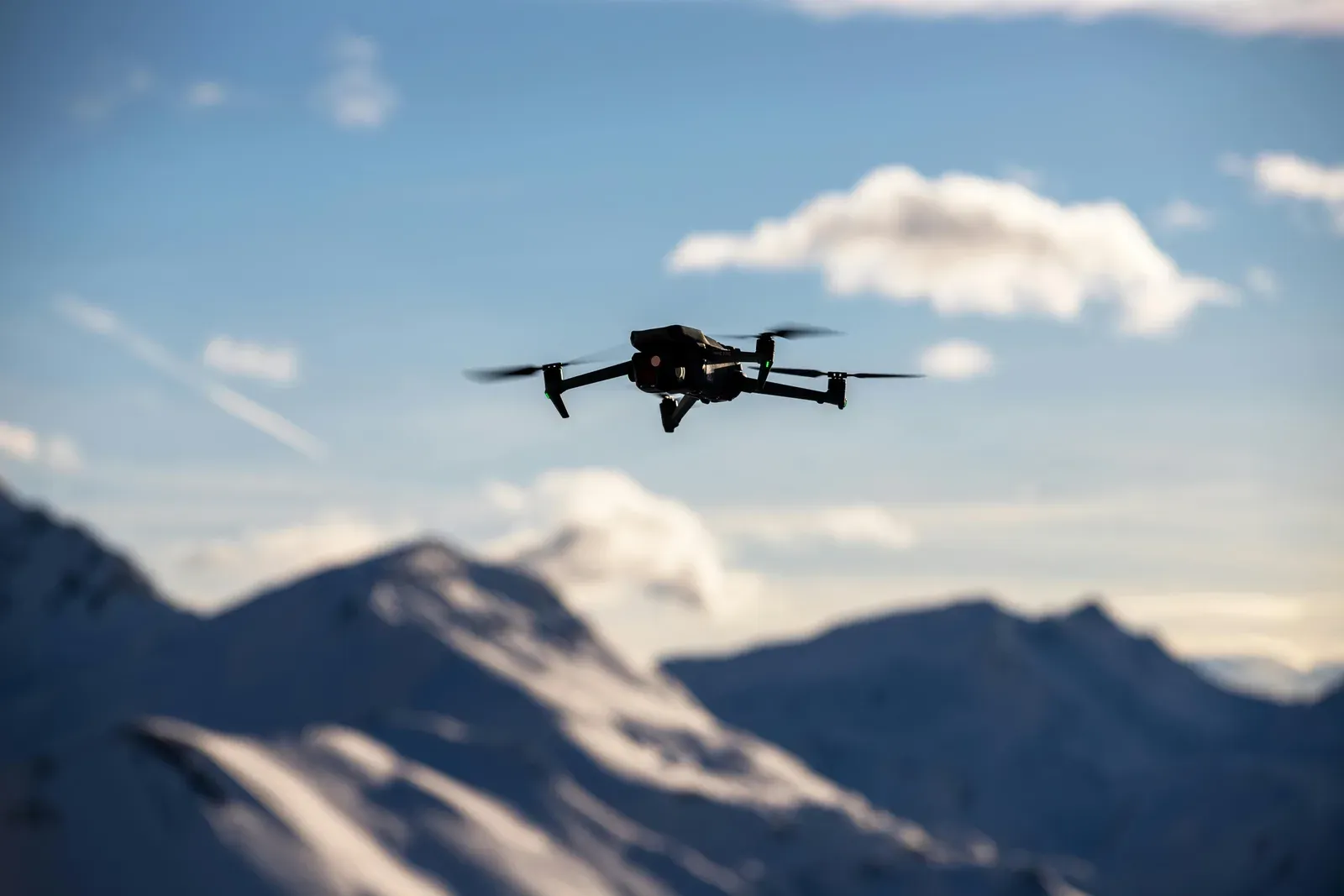 Commercial drone flying beyond visual line of sight over open terrain