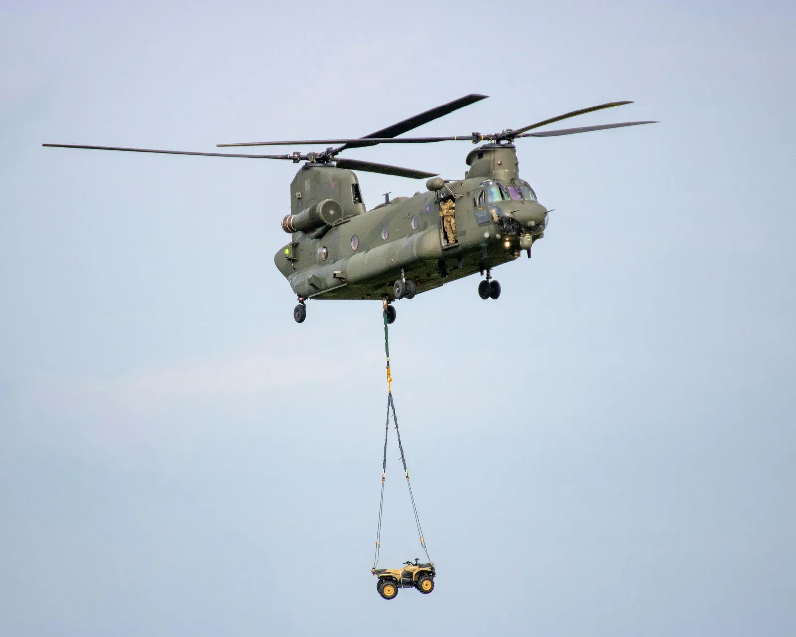 A military unmanned cargo drone being prepared for a tactical resupply mission