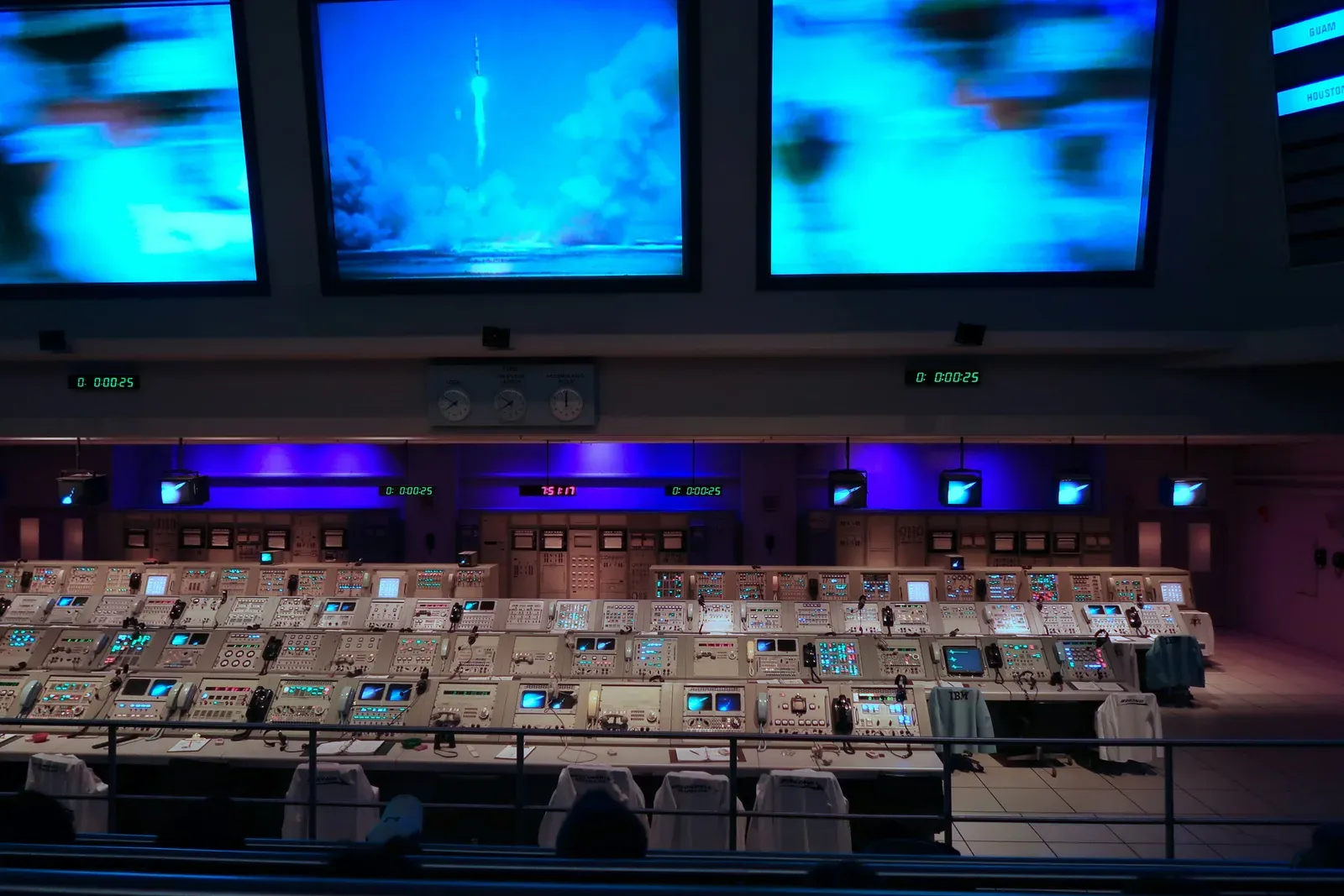 Operators monitoring drone traffic management systems on control room screens