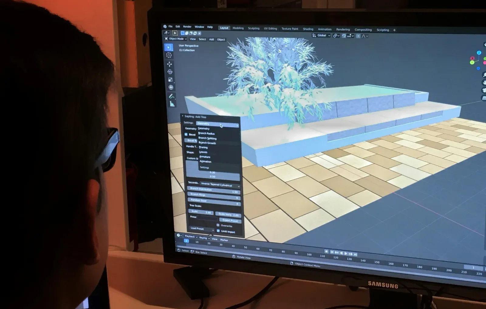 Engenheiro analisando modelo tridimensional do terreno em estação de trabalho