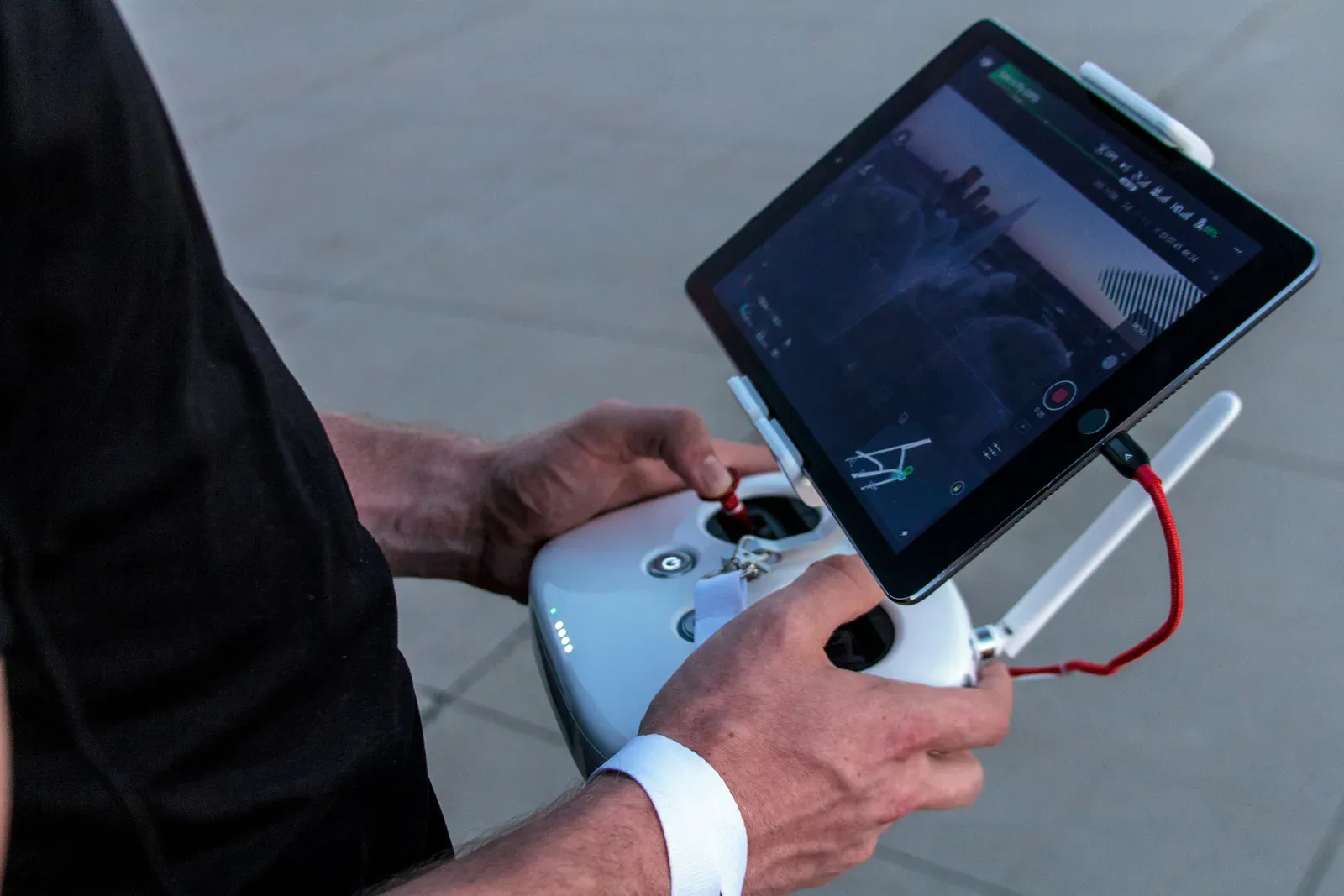 Drone pilot running a field deployment with a tablet ground control station
