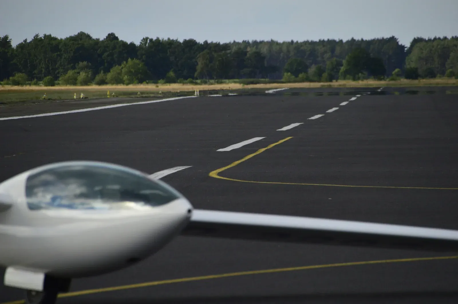 An electric lift-plus-cruise VTOL cargo aircraft on a runway