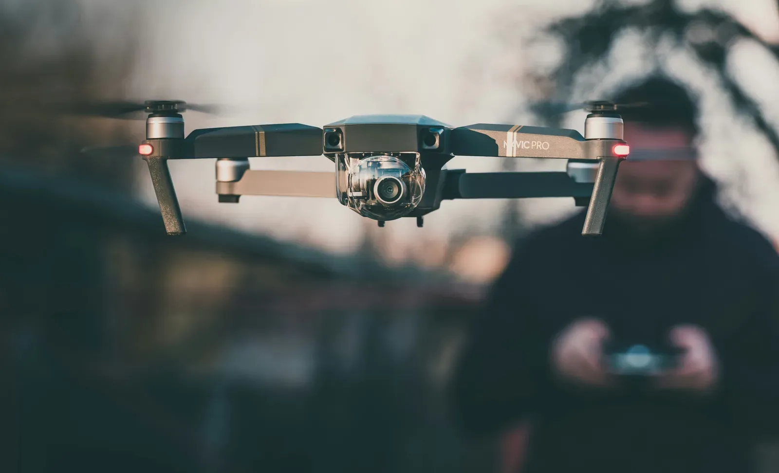Technician inspecting a professional drone alongside a maintenance checklist
