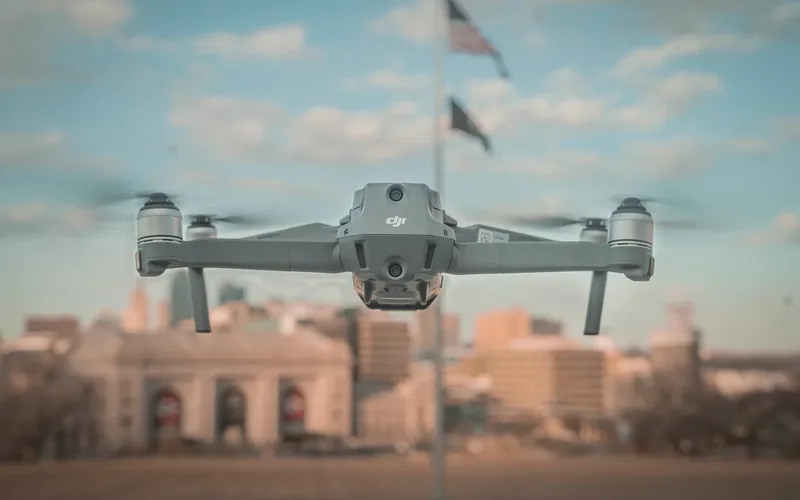 Commercial drone flying with an American flag in the background