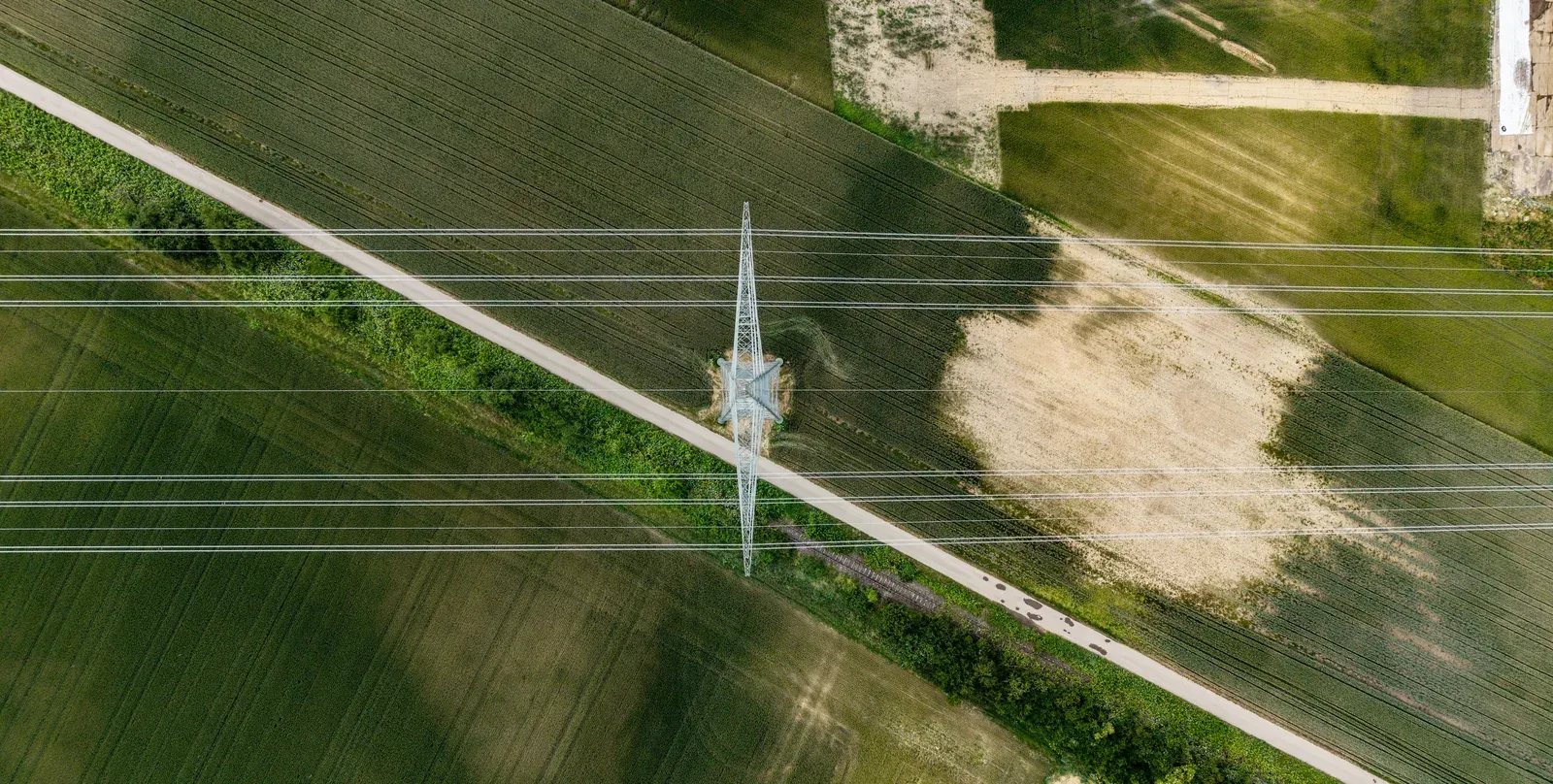 Drone inspecting high-voltage power transmission lines
